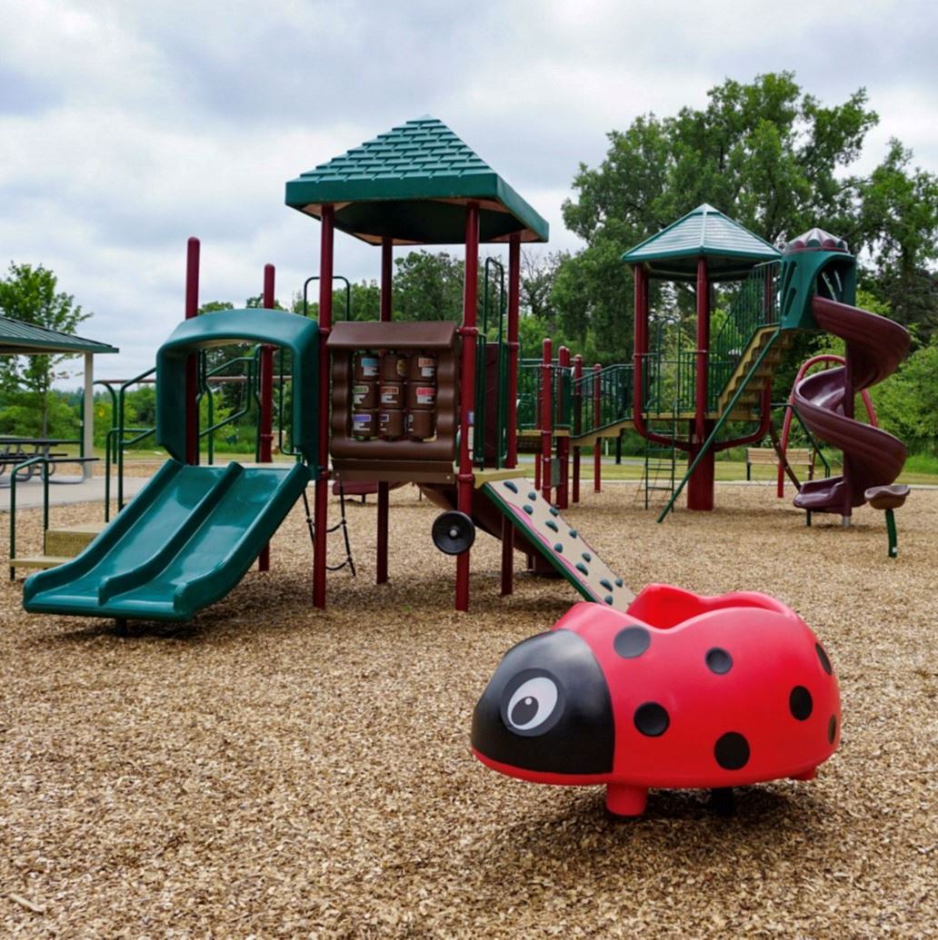 Valentine Hills Park Playground Equipment with Ladybug-shaped Toy Landscape orientation